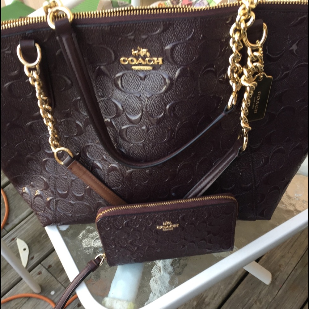 Coach wine color purse with wallet